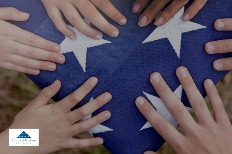 Folds of Honor logo with hands on a folded American Flag